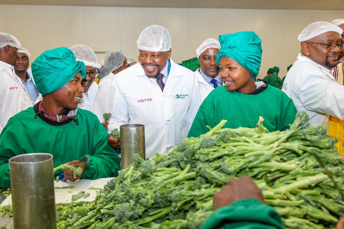 CS Kagwe interacting with workers at Veg Farm